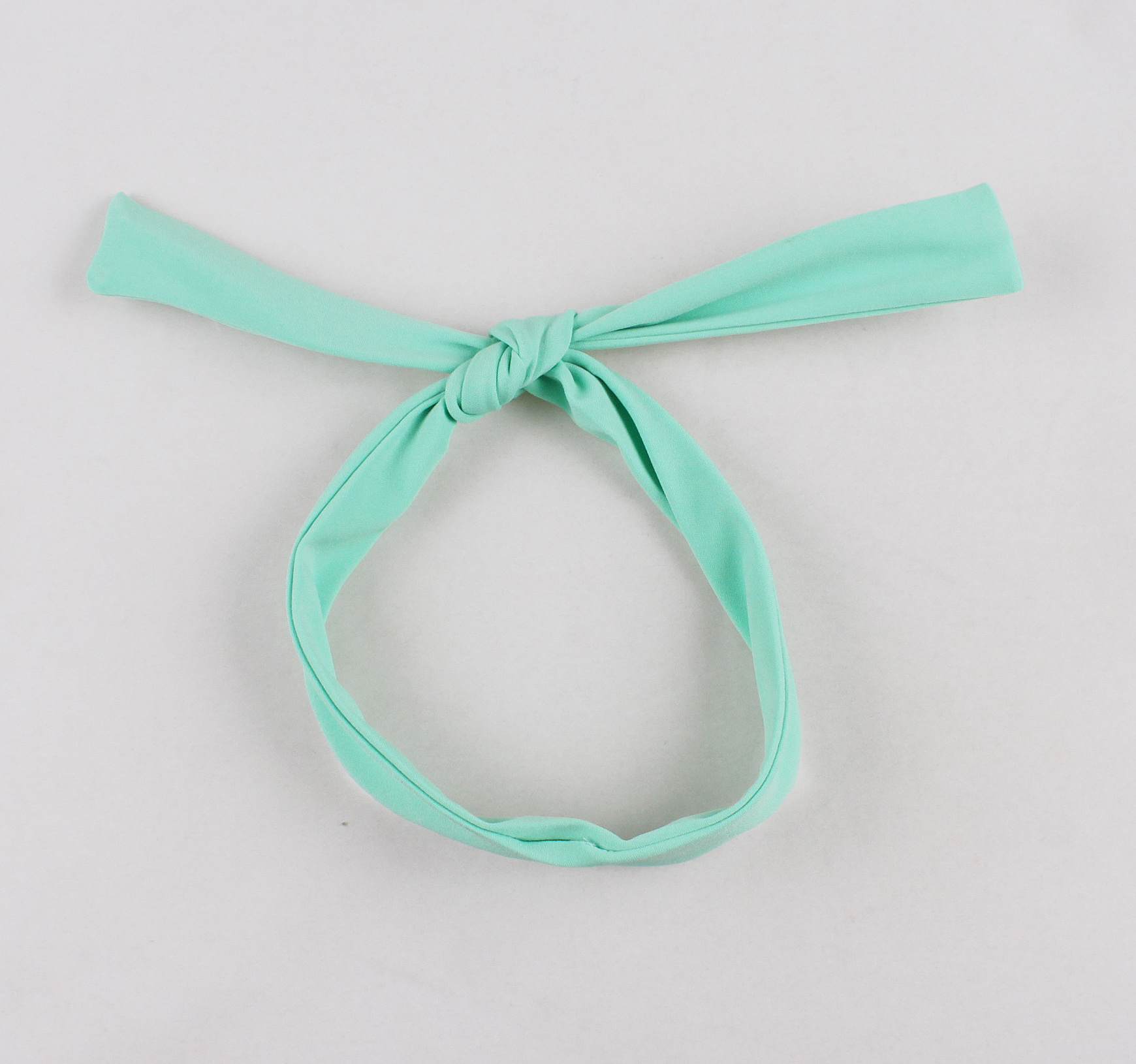 Vintage style, Mint green color, Short sleeve, White collar and belt, Decorative bow with black buttons, Flared A-line skirt, Matching headband included, Comfortable fabric, Perfect for themed events, Easy-to-wear classic design #N23819