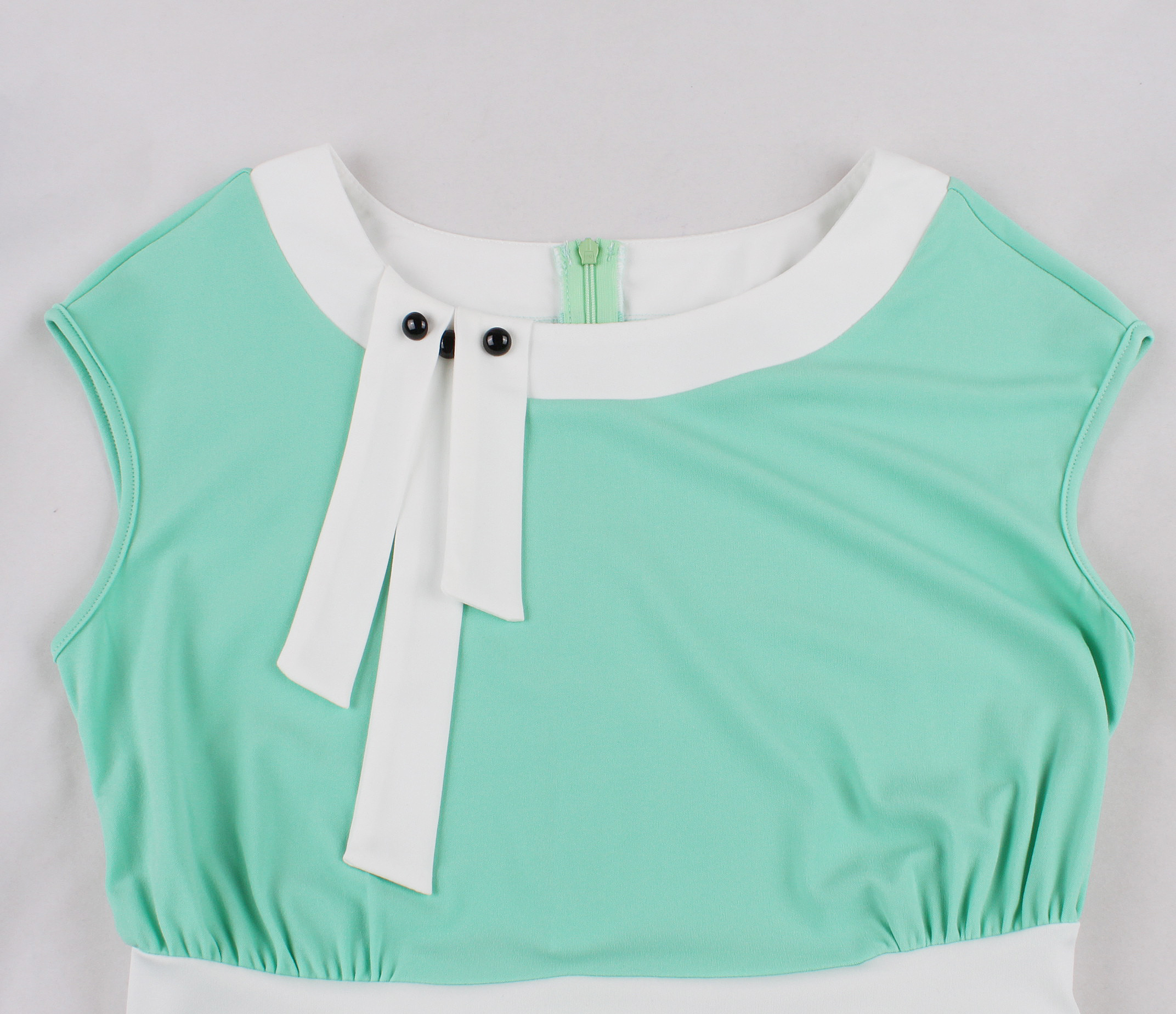 Vintage style, Mint green color, Short sleeve, White collar and belt, Decorative bow with black buttons, Flared A-line skirt, Matching headband included, Comfortable fabric, Perfect for themed events, Easy-to-wear classic design #N23819