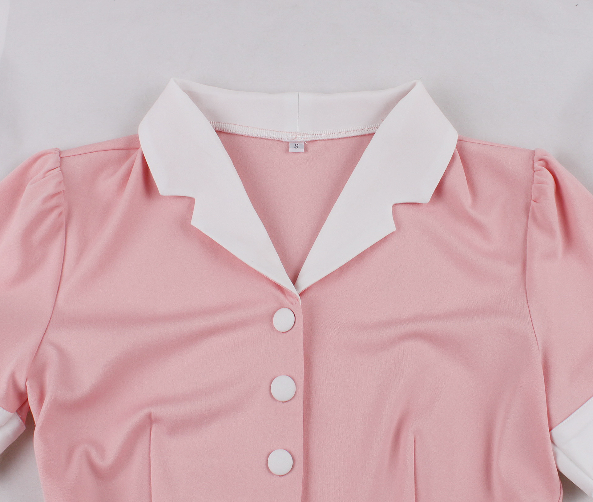 Vintage style, Sweetheart neckline, Puffed lace sleeves, White waist belt with heart-shaped buckle, Strawberry print skirt, Checkered background, A-line silhouette, Mid-length design, Romantic and sweet, Valentine