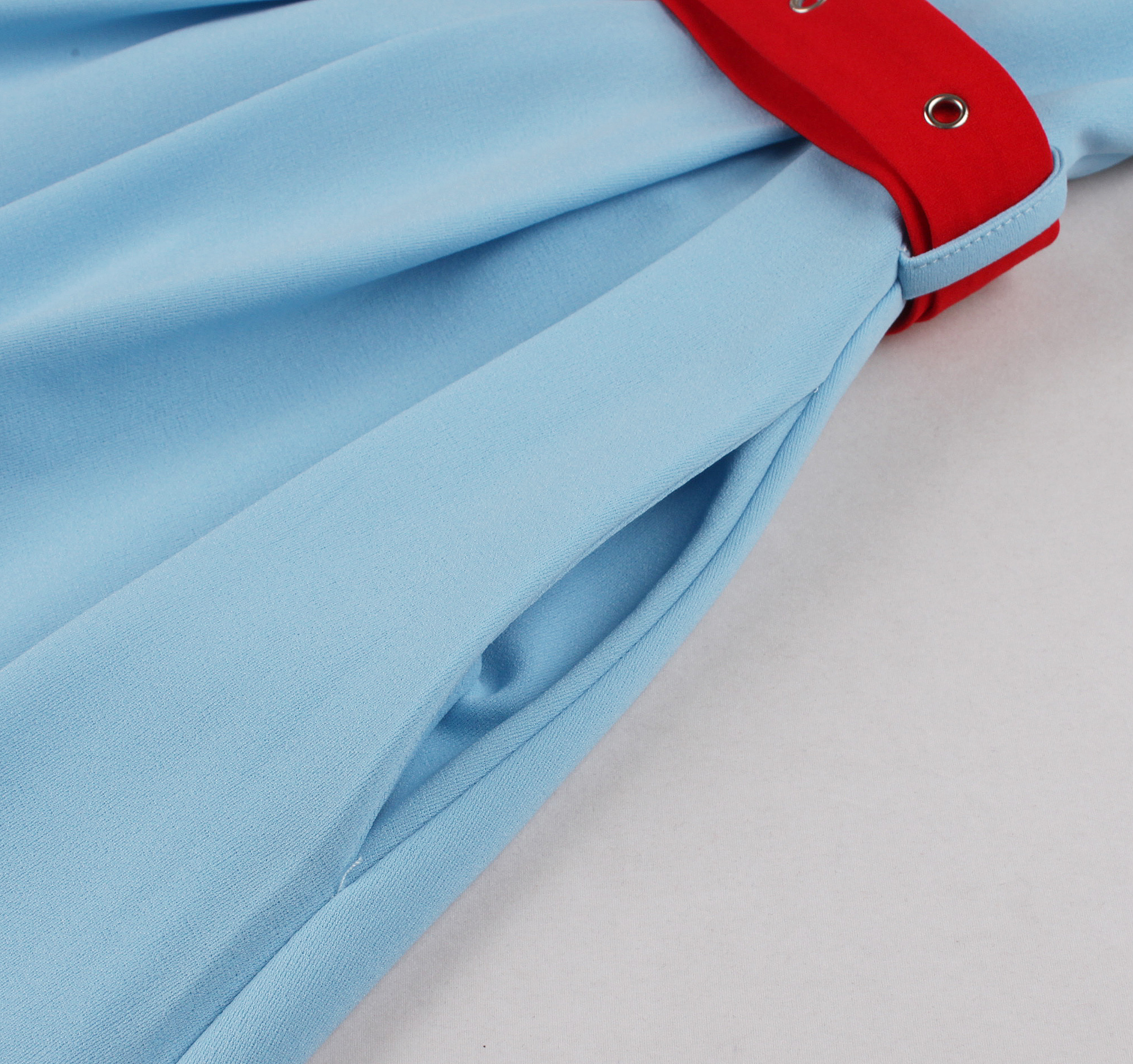 Vintage style, Royal blue color, White contrast belt, Five front buttons, A-line skirt, Sleeveless design, Lightweight fabric, Shift dress silhouette, Classic retro fashion, Easy to wear #N23823