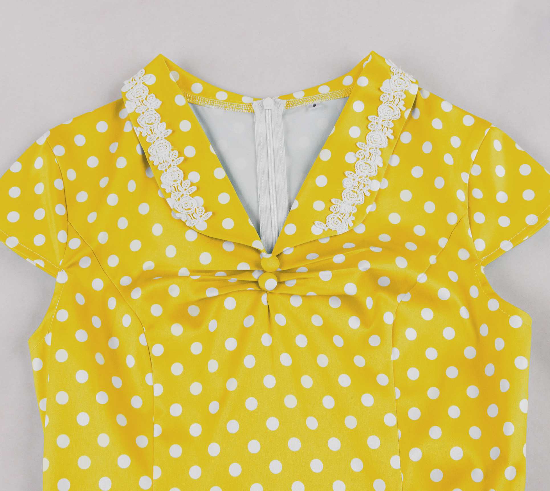 vintage polka dot dress, yellow with white dots, 1950s style, V-neck with lace trim, cap sleeves, gathered bodice, adjustable waist belt, black rectangular buckle, A-line swing skirt, knee length #N23826